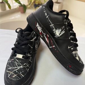 Nike Black Low-Top Sneakers with White and Red Paint-Splatter